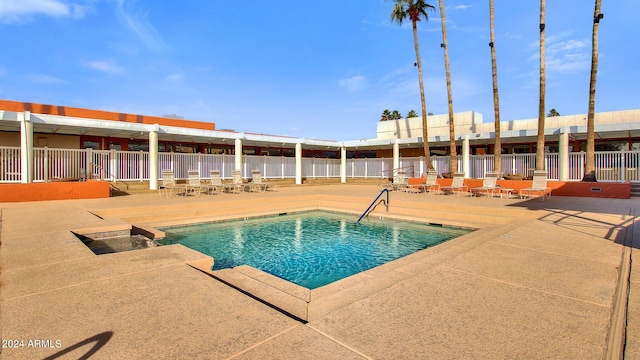 view of swimming pool with a patio