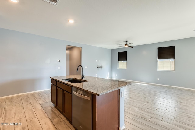 kitchen featuring dishwasher, a sink, a ceiling fan, and wood tiled floor