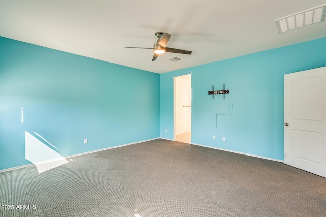 interior space featuring ceiling fan, visible vents, and baseboards