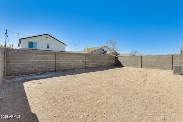 view of yard featuring a fenced backyard and cooling unit