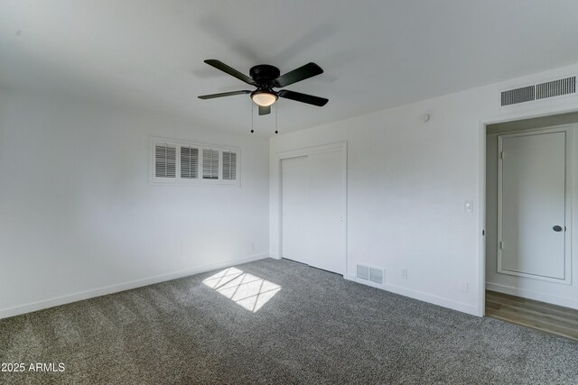 unfurnished bedroom featuring visible vents and baseboards