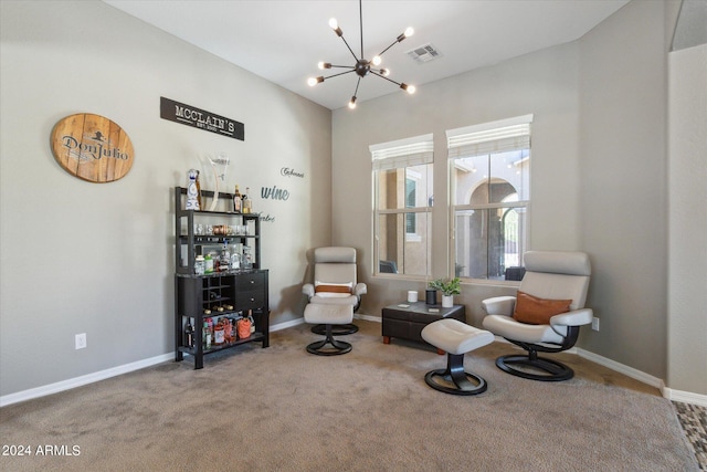 sitting room with an inviting chandelier and carpet flooring