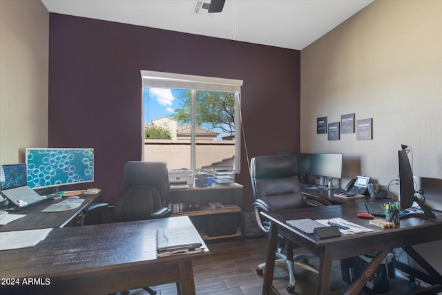 office space with lofted ceiling, ceiling fan, and dark wood-type flooring