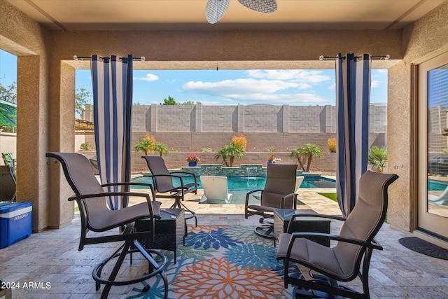 view of patio with a fenced in pool