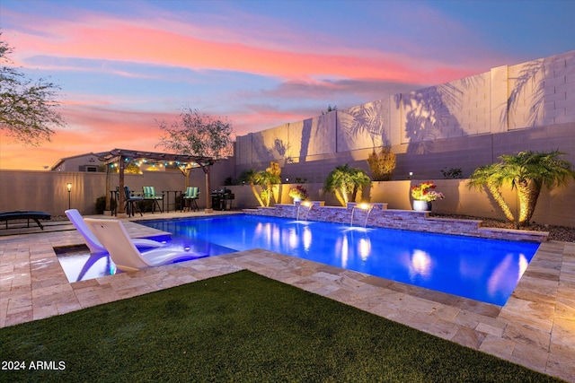 pool at dusk with a patio, a pergola, and pool water feature