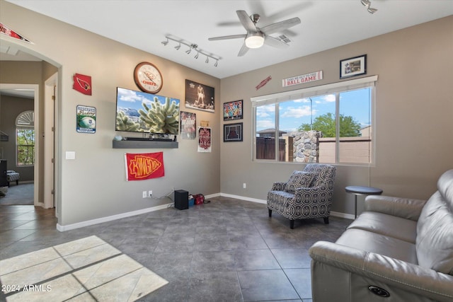 sitting room with rail lighting, tile flooring, and ceiling fan