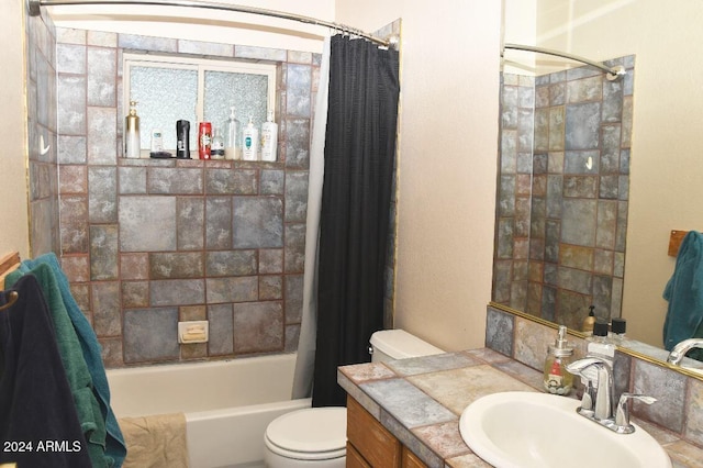 full bathroom featuring shower / bath combo, toilet, and vanity