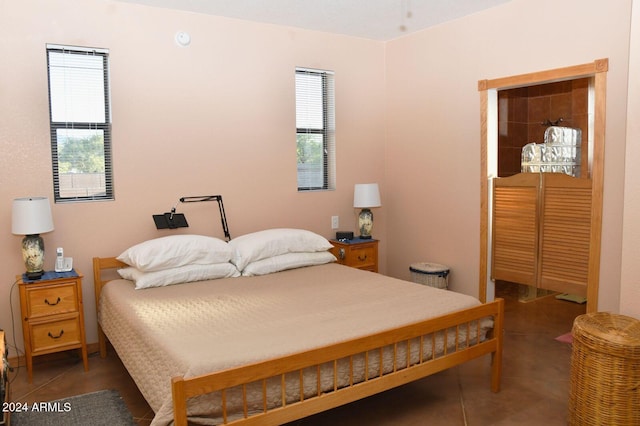 bedroom featuring dark tile patterned floors