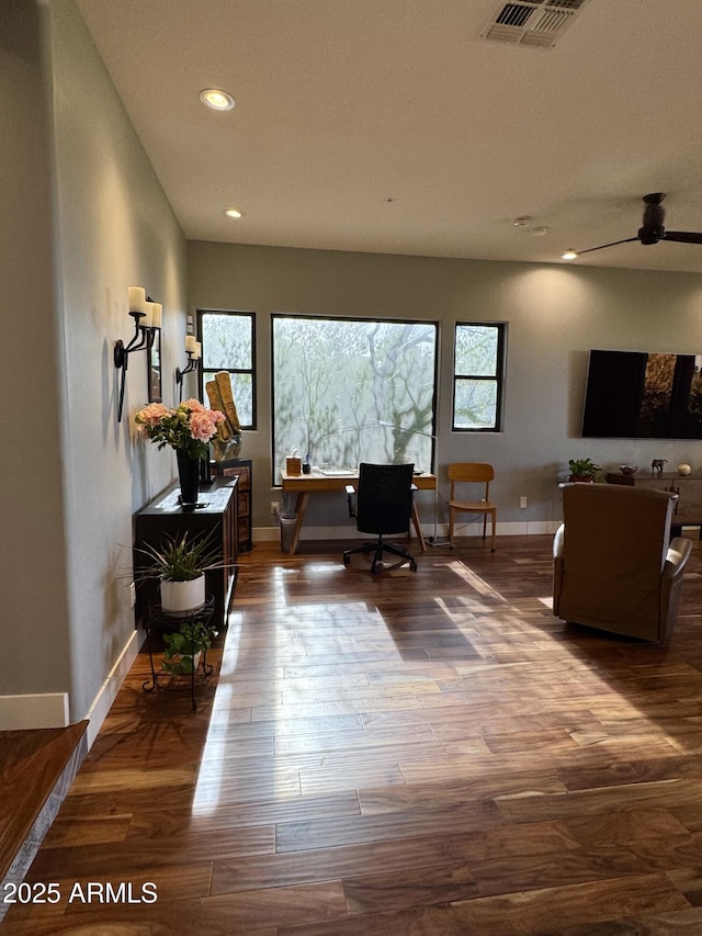 office with hardwood / wood-style flooring and ceiling fan