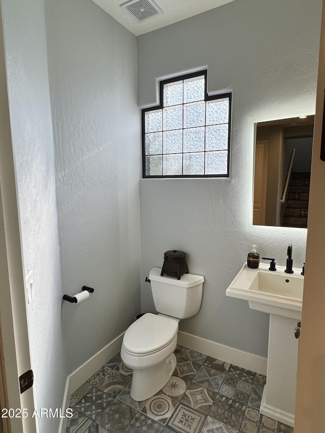 bathroom featuring toilet