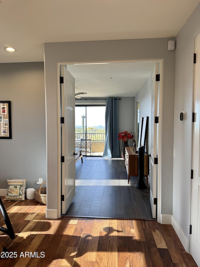 corridor with dark wood-type flooring