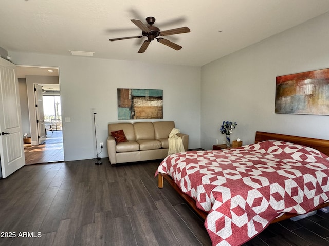 bedroom with ceiling fan and dark hardwood / wood-style flooring