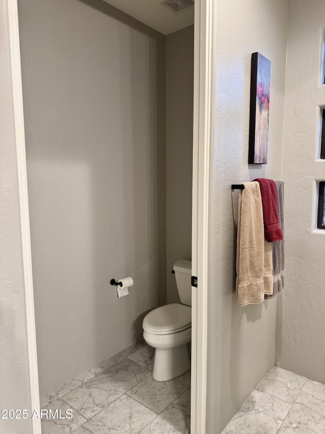 bathroom featuring toilet