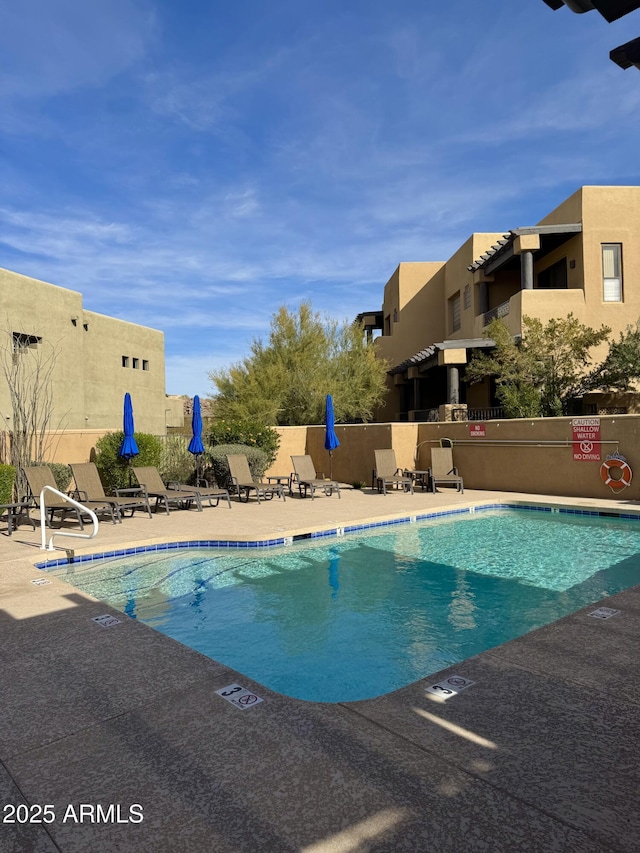 view of pool with a patio area