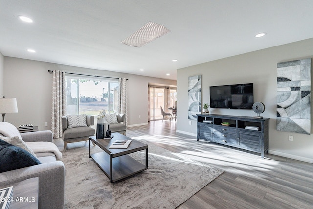 living room with light hardwood / wood-style flooring