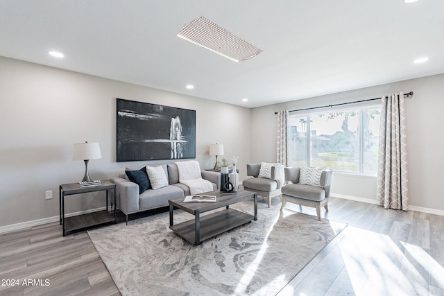 living room with light hardwood / wood-style floors