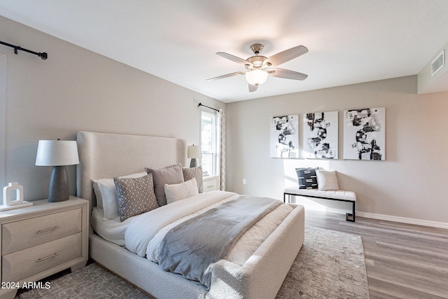 bedroom featuring hardwood / wood-style flooring and ceiling fan