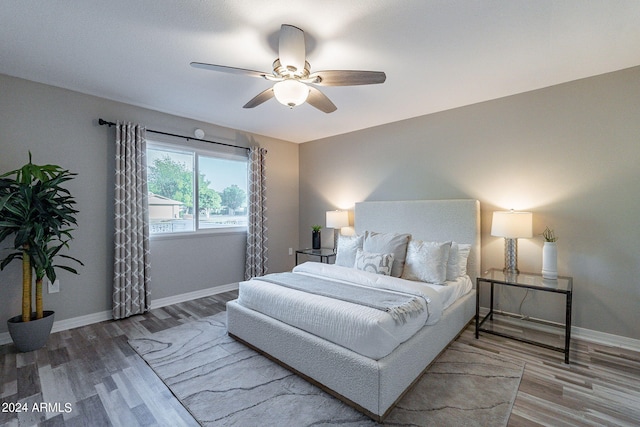 bedroom featuring ceiling fan and wood-type flooring