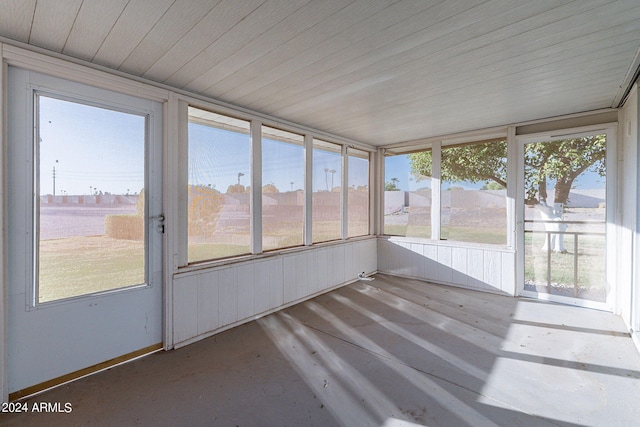 unfurnished sunroom featuring plenty of natural light