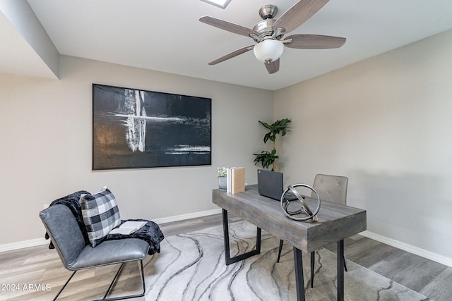 office area with hardwood / wood-style floors and ceiling fan