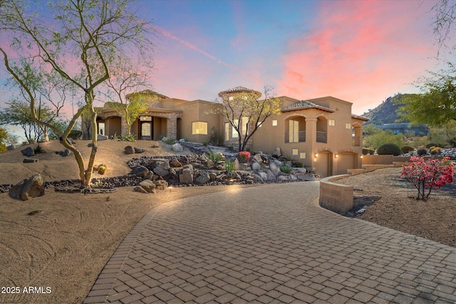 view of front of property with a garage