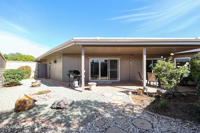 rear view of house featuring a patio