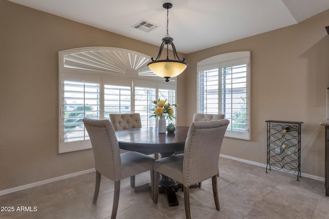 dining room featuring visible vents and baseboards