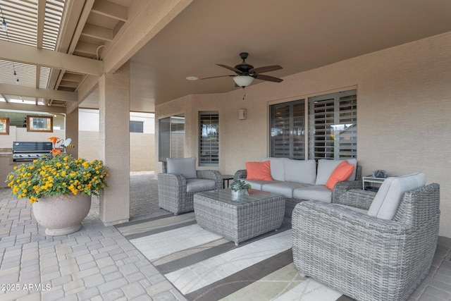 view of patio with an outdoor living space, a grill, and ceiling fan