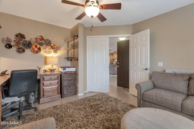 office space featuring light tile patterned floors and a ceiling fan