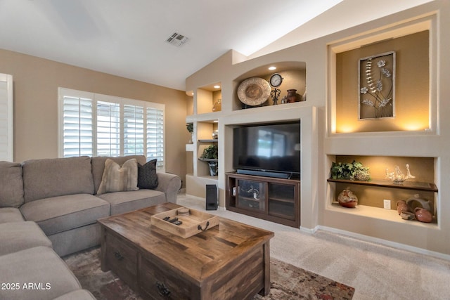 carpeted living room featuring built in features, baseboards, and lofted ceiling