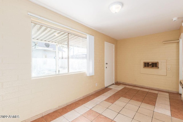 unfurnished room with light tile patterned floors