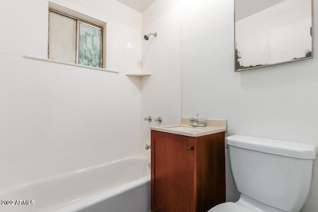 bathroom with washtub / shower combination, vanity, and toilet