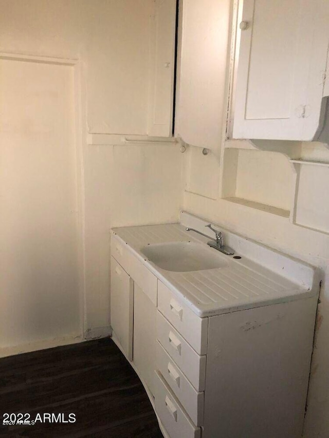 bathroom with vanity and wood finished floors