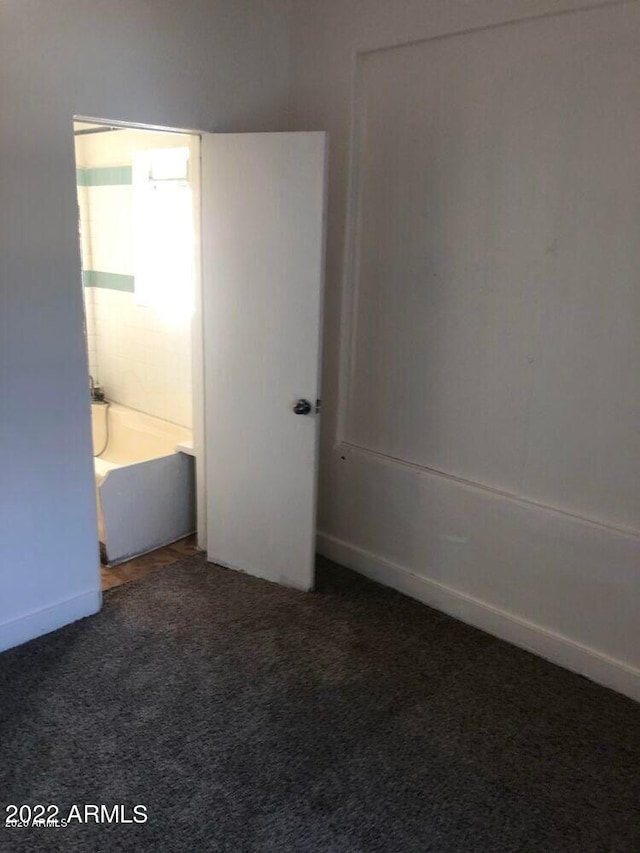 unfurnished bedroom with carpet