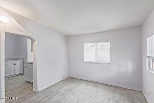 unfurnished room featuring light wood-style flooring