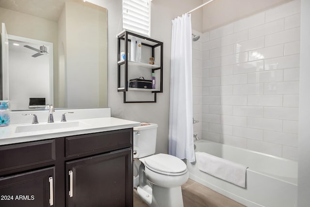 full bathroom with vanity, shower / bath combination with curtain, and toilet