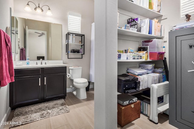 bathroom featuring vanity and toilet