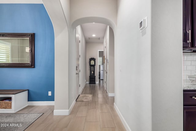 corridor featuring light hardwood / wood-style floors