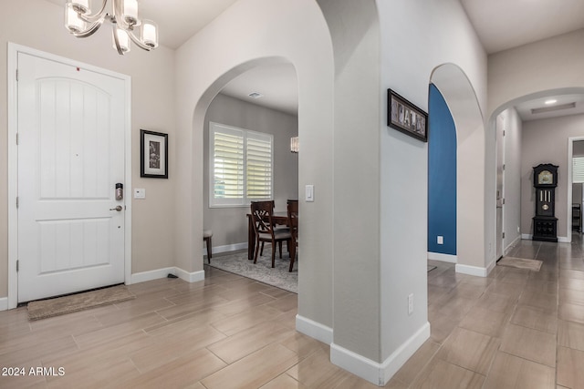 foyer featuring a notable chandelier