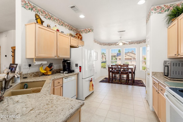 kitchen featuring light brown cabinetry, ceiling fan, sink, and white appliances