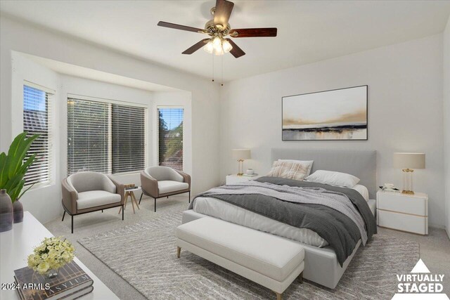 bedroom featuring ceiling fan and light colored carpet