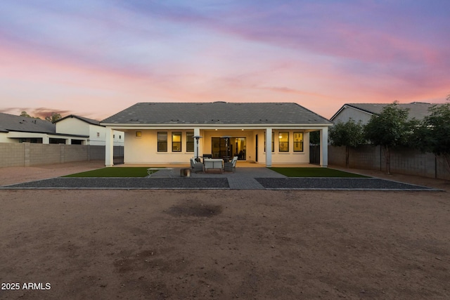 1294 E Ln Fortuna Ct, San Tan Valley, AZ 85140 - back of property featuring a patio, a fenced backyard, and stucco siding