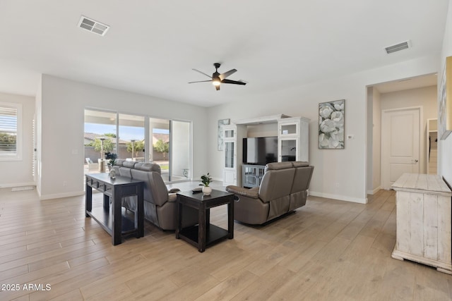 1294 E Ln Fortuna Ct, San Tan Valley, AZ 85140 - living area featuring ceiling fan and light wood finished floors