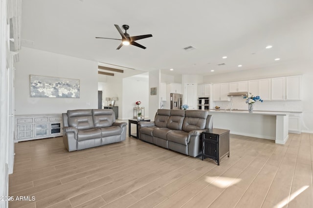 1294 E Ln Fortuna Ct, San Tan Valley, AZ 85140 - living room with a ceiling fan, light wood-style flooring, and recessed lighting