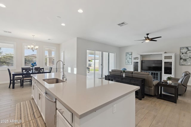 1294 E Ln Fortuna Ct, San Tan Valley, AZ 85140 - kitchen with light wood-style flooring, a chandelier, white cabinets, light countertops, and recessed lighting