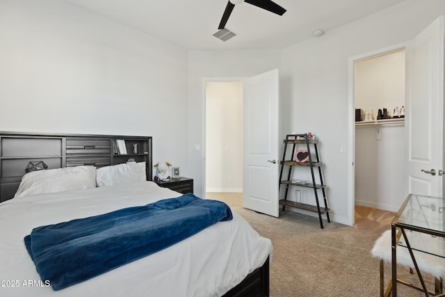 1294 E Ln Fortuna Ct, San Tan Valley, AZ 85140 - bedroom with light colored carpet, a spacious closet, and ceiling fan