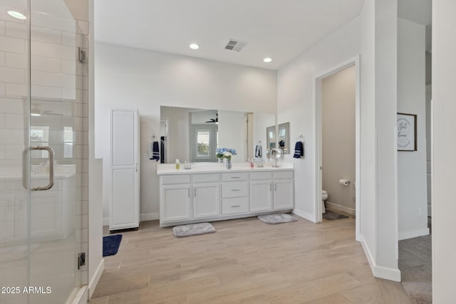 1294 E Ln Fortuna Ct, San Tan Valley, AZ 85140 - full bath featuring double vanity, a stall shower, recessed lighting, and wood finished floors