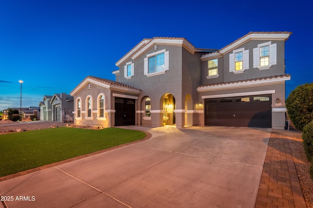 6621 S Balboa Dr, Gilbert, AZ 85298 - mediterranean / spanish-style home featuring an attached garage, driveway, a tile roof, and stucco siding