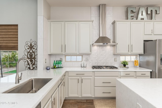 6621 S Balboa Dr, Gilbert, AZ 85298 - kitchen featuring wall chimney exhaust hood, stainless steel appliances, a sink, and plenty of natural light