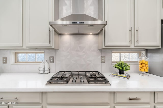 6621 S Balboa Dr, Gilbert, AZ 85298 - kitchen featuring wall chimney exhaust hood, stainless steel gas stovetop, backsplash, and healthy amount of natural light